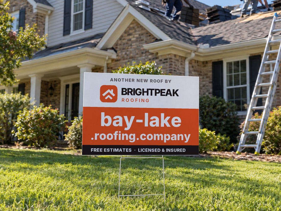 bay-lake.roofing.company on a yard sign in front of a house getting a new roof